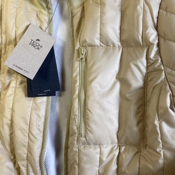 NWT Woman Nike Therma-FIT Tech Pack Long Puffer Jacket Gold Sz S Reg $200